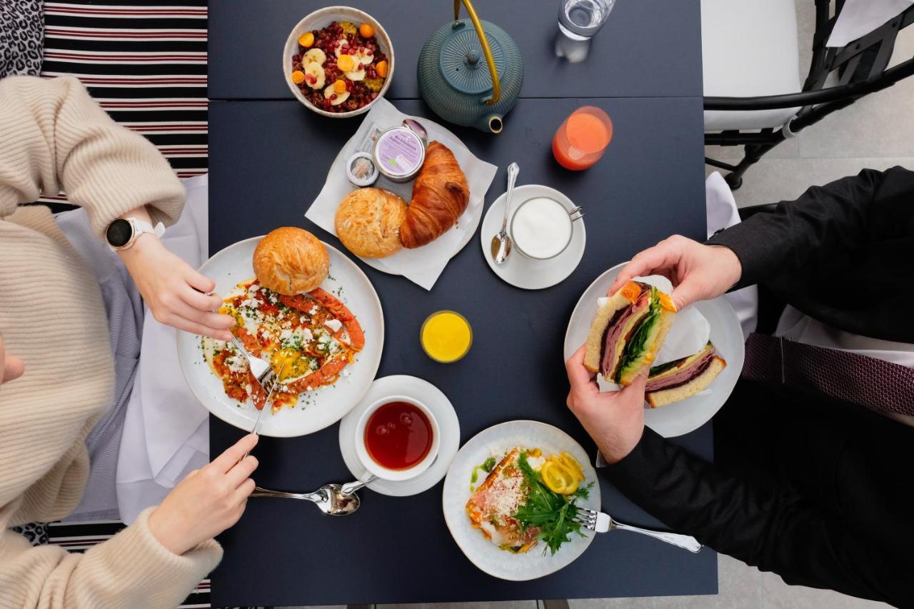 The Leo Grand Hotel Vienna Exterior photo A typical breakfast at the restaurant